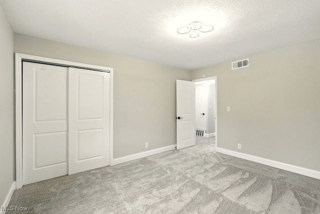 5830 Spotswood Dr, Lyndhurst, OH 44124 - unfurnished bedroom with carpet floors, a closet, and a textured ceiling