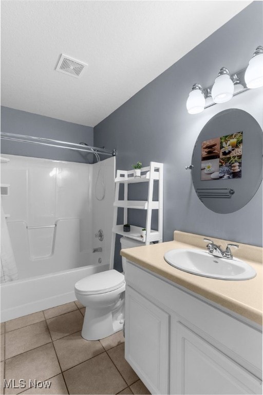 313 Crimson Cir, Campbell, OH 44405 - bathroom featuring vanity, tile patterned floors, and shower / tub combination