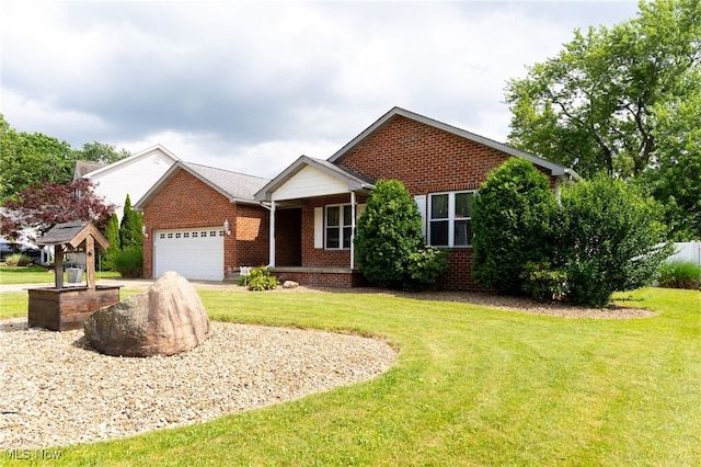 313 Crimson Cir, Campbell, OH 44405 - view of front of home featuring a garage, brick siding, a front lawn, and covered porch