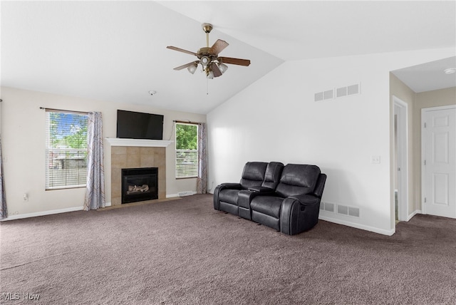313 Crimson Cir, Campbell, OH 44405 - carpeted living area featuring ceiling fan, lofted ceiling, and a tiled fireplace