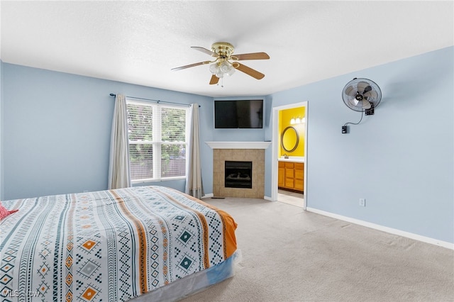 313 Crimson Cir, Campbell, OH 44405 - carpeted bedroom with a fireplace, ceiling fan, and ensuite bath
