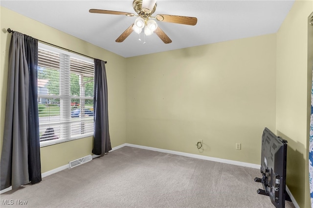 313 Crimson Cir, Campbell, OH 44405 - carpeted spare room featuring baseboards and a ceiling fan