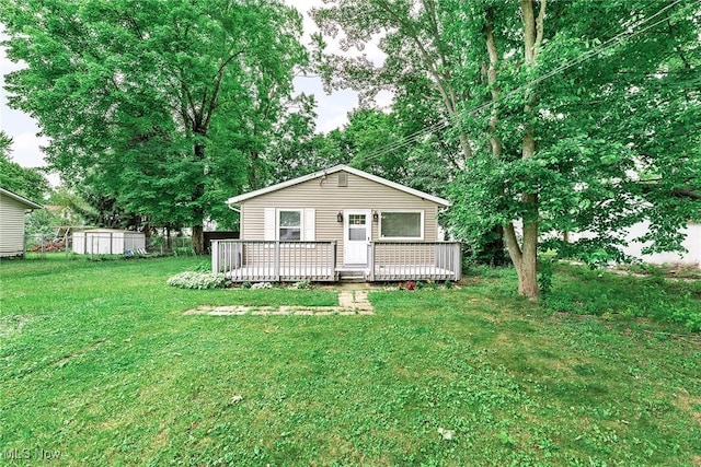 929 Moneta Ave, Aurora, OH 44202 - view of front of house featuring a wooden deck and a front lawn
