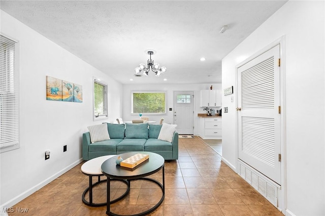 929 Moneta Ave, Aurora, OH 44202 - living area with a chandelier, light tile patterned floors, and recessed lighting