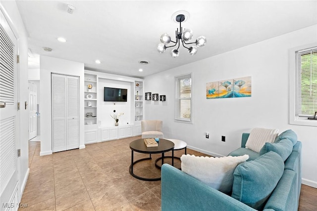 929 Moneta Ave, Aurora, OH 44202 - living area featuring a chandelier, built in features, recessed lighting, and light tile patterned floors