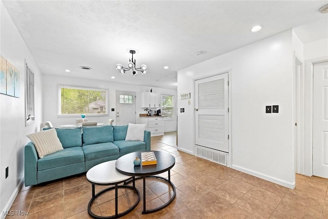 929 Moneta Ave, Aurora, OH 44202 - living area with a chandelier, recessed lighting, and light tile patterned flooring