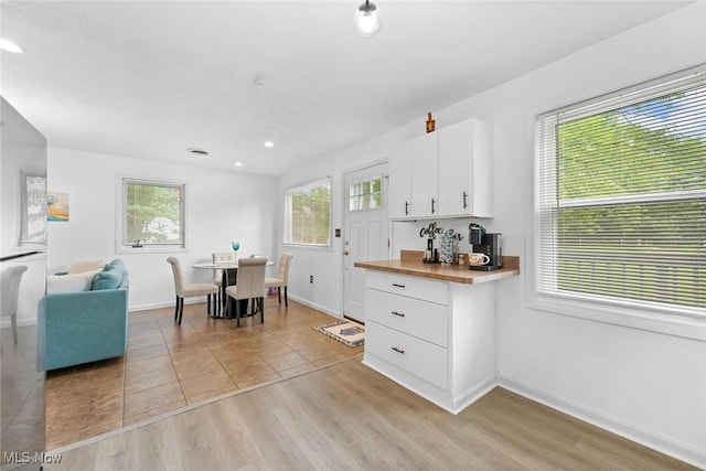 929 Moneta Ave, Aurora, OH 44202 - kitchen with white cabinets, recessed lighting, light wood-type flooring, and open floor plan