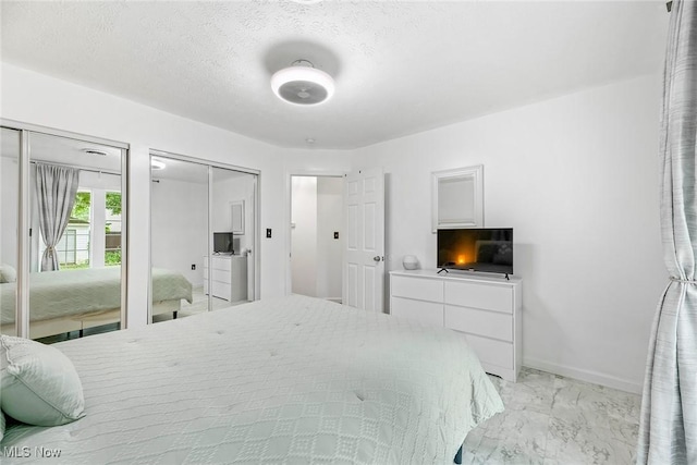 929 Moneta Ave, Aurora, OH 44202 - bedroom featuring light marble finish flooring and multiple closets
