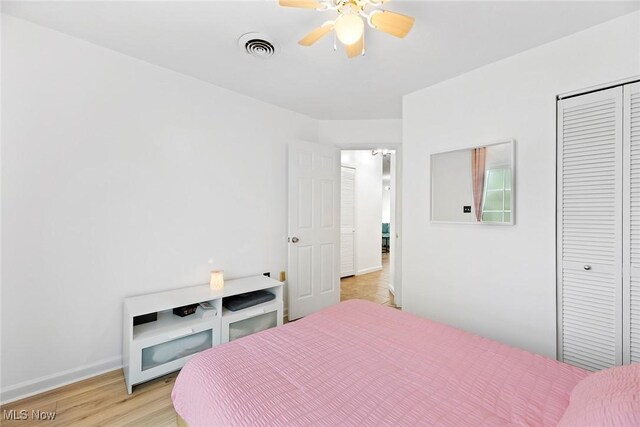 929 Moneta Ave, Aurora, OH 44202 - bedroom featuring light wood-style floors, a closet, and a ceiling fan
