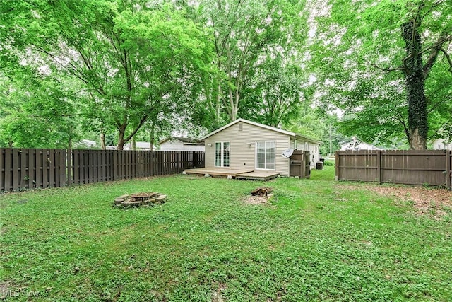 929 Moneta Ave, Aurora, OH 44202 - fenced backyard with an outdoor fire pit and a wooden deck