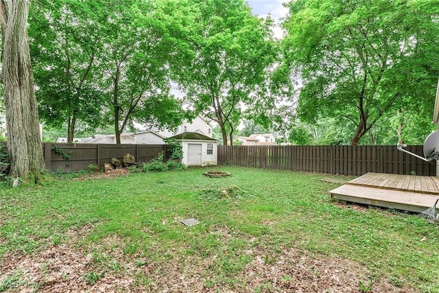 929 Moneta Ave, Aurora, OH 44202 - fenced backyard with a storage unit and a wooden deck