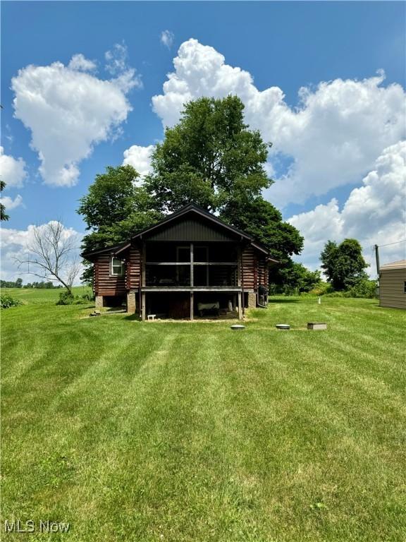 1917 Township Road 26, Killbuck, OH 44637 - rear view of house with a lawn