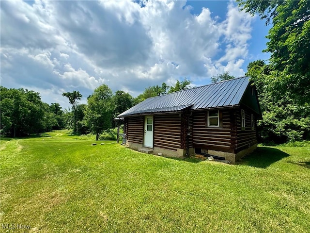 1917 Township Road 26, Killbuck, OH 44637 - back of property featuring log siding, a yard, and a metal roof