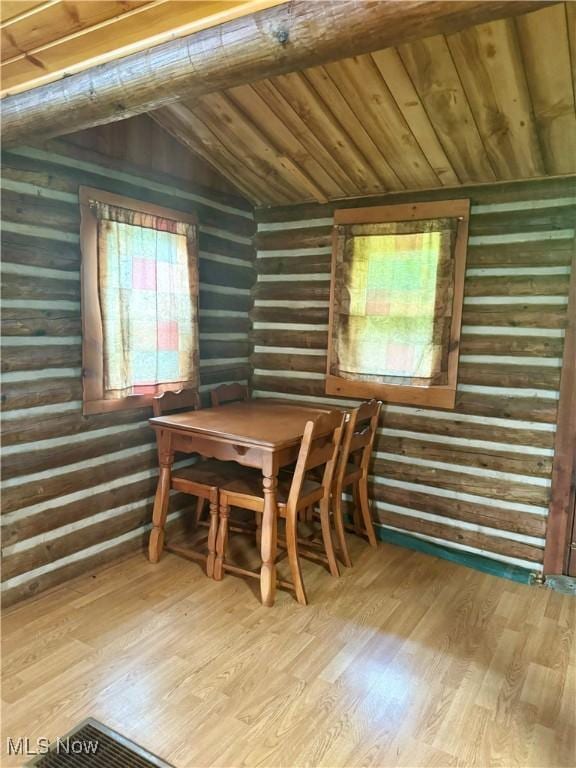 1917 Township Road 26, Killbuck, OH 44637 - unfurnished dining area with lofted ceiling, wood finished floors, and wooden ceiling