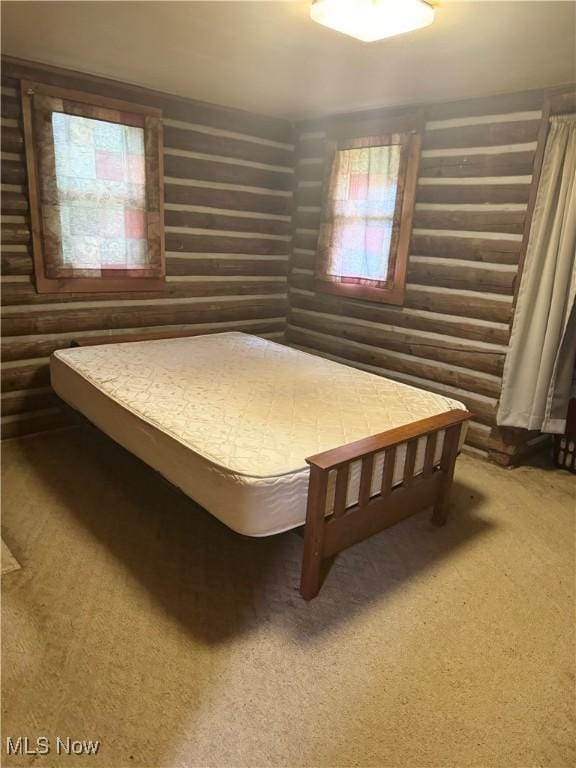 1917 Township Road 26, Killbuck, OH 44637 - bedroom featuring rustic walls and carpet floors