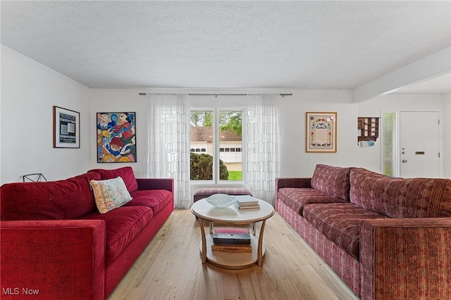2632 S Green Rd, University Heights, OH 44122 - living area featuring light wood-type flooring and a textured ceiling
