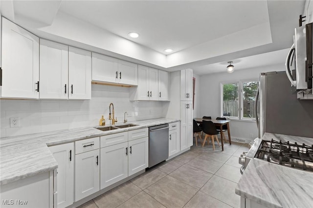 2632 S Green Rd, University Heights, OH 44122 - kitchen featuring stainless steel appliances, decorative backsplash, white cabinetry, light tile patterned floors, and recessed lighting