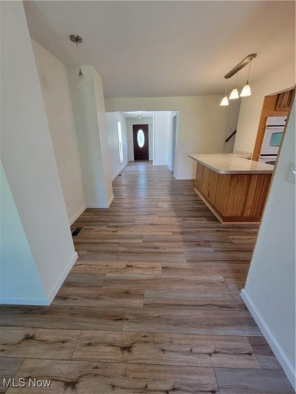 262 High St, Conneaut, OH 44030 - hall with wood finished floors and baseboards