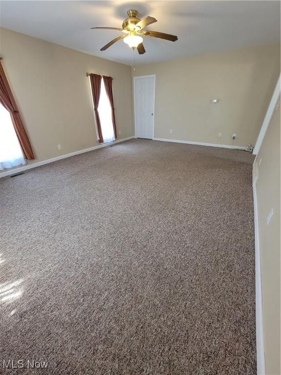 262 High St, Conneaut, OH 44030 - carpeted spare room featuring ceiling fan and baseboards