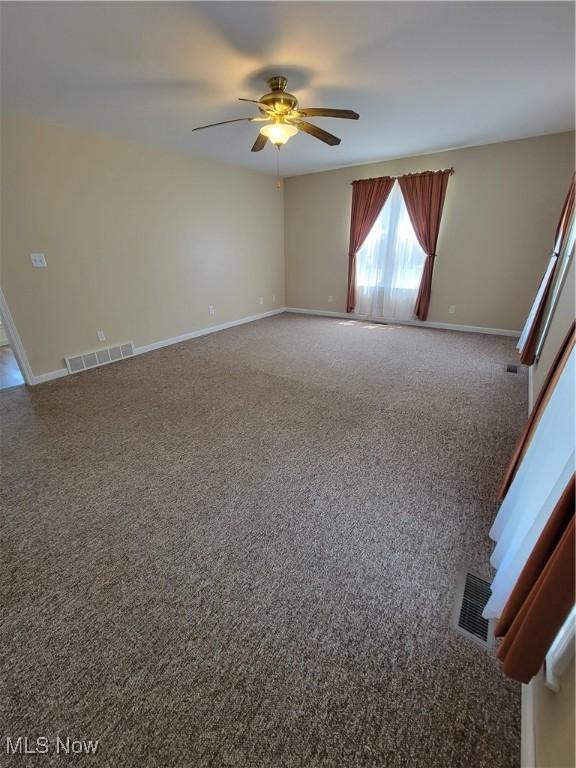262 High St, Conneaut, OH 44030 - carpeted spare room with ceiling fan and baseboards