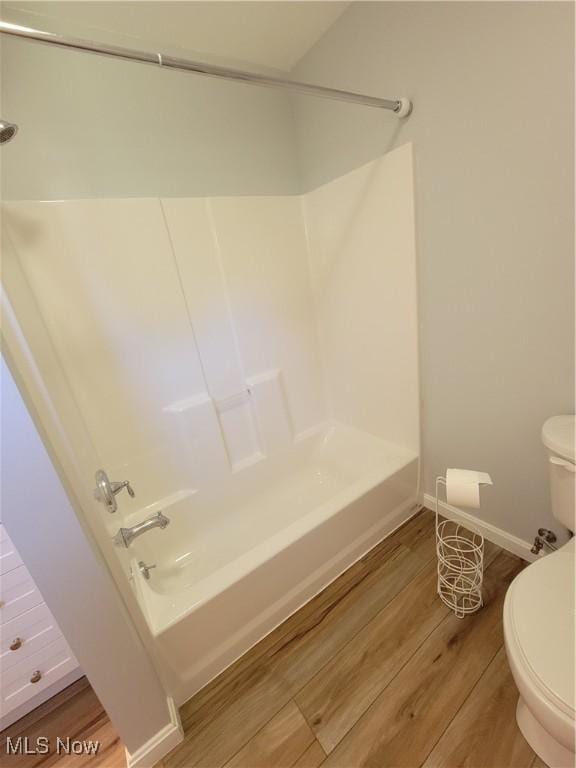 262 High St, Conneaut, OH 44030 - full bath featuring wood finished floors and washtub / shower combination