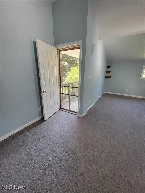 262 High St, Conneaut, OH 44030 - spare room featuring carpet and lofted ceiling