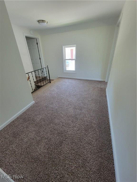 262 High St, Conneaut, OH 44030 - carpeted spare room featuring baseboards
