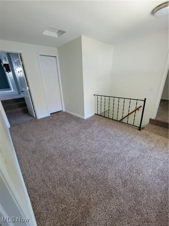 262 High St, Conneaut, OH 44030 - carpeted empty room with baseboards
