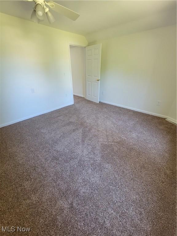 262 High St, Conneaut, OH 44030 - carpeted empty room featuring baseboards and a ceiling fan