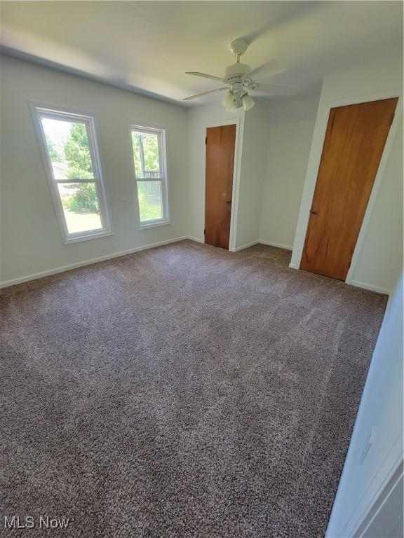 262 High St, Conneaut, OH 44030 - unfurnished bedroom with carpet flooring and ceiling fan
