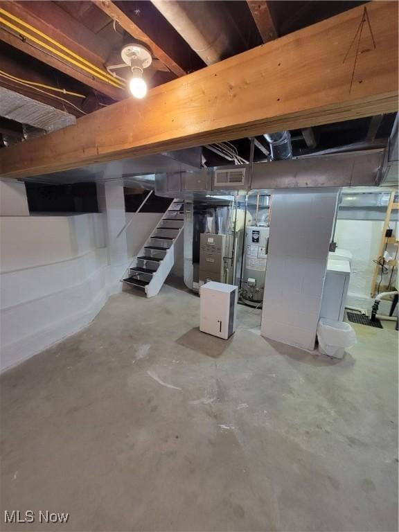 262 High St, Conneaut, OH 44030 - unfinished below grade area featuring water heater and stairs