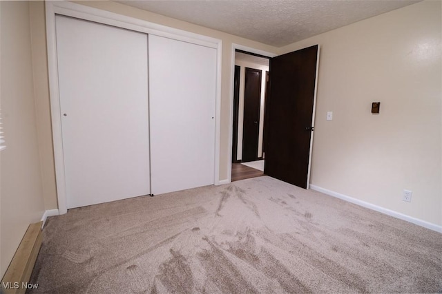 961 Slater Rd, Salem, OH 44460 - unfurnished bedroom with carpet, a textured ceiling, and a closet