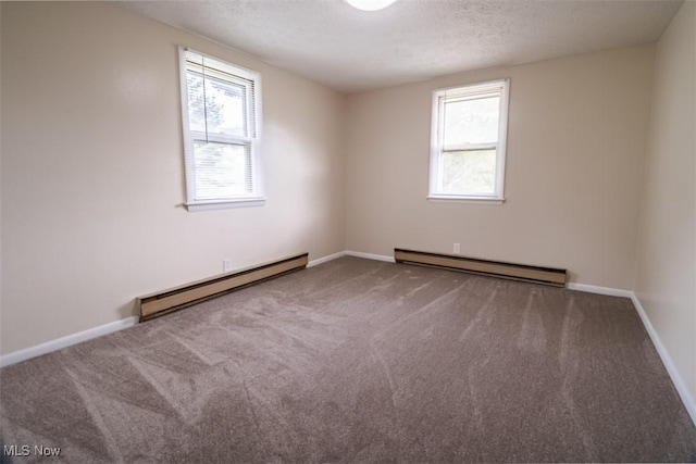 961 Slater Rd, Salem, OH 44460 - carpeted spare room featuring a baseboard heating unit, plenty of natural light, and a textured ceiling