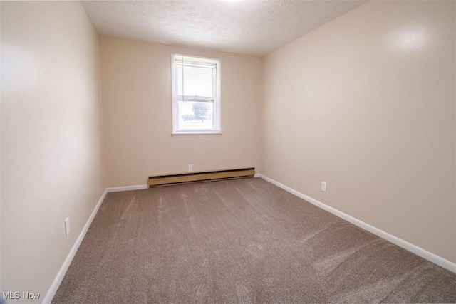 961 Slater Rd, Salem, OH 44460 - spare room featuring baseboard heating, carpet, and a textured ceiling