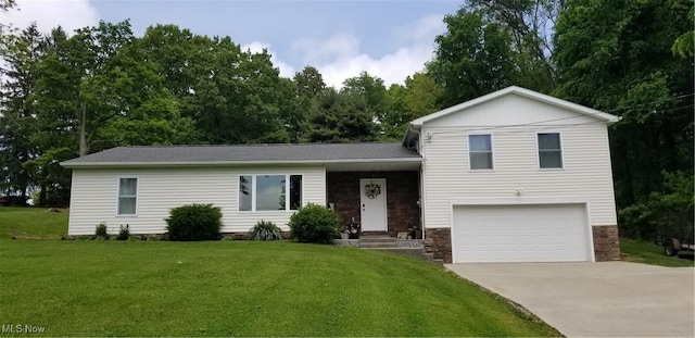 29928 Buck Rd, Salem, OH 44460 - split level home featuring a garage, concrete driveway, a front lawn, and stone siding