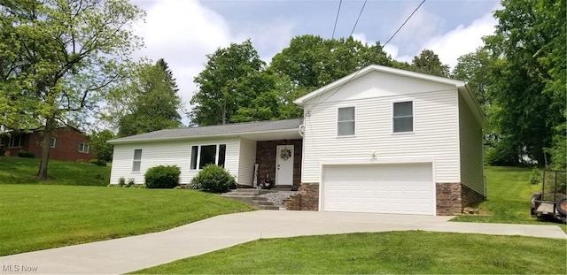 29928 Buck Rd, Salem, OH 44460 - split level home with driveway, stone siding, a garage, and a front yard
