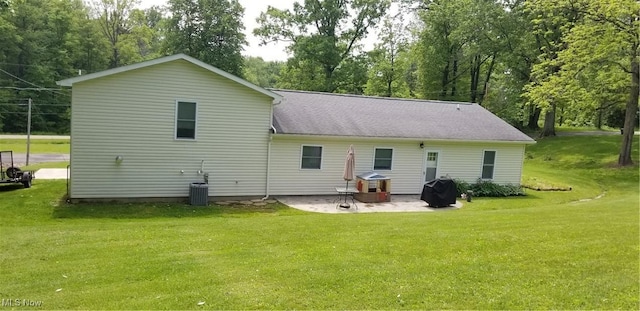 29928 Buck Rd, Salem, OH 44460 - rear view of property featuring a patio, a yard, and view of wooded area