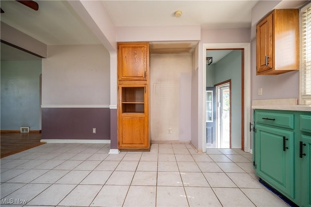 135 Renee Dr, Struthers, OH 44471 - kitchen with light tile patterned floors, light countertops, and ceiling fan