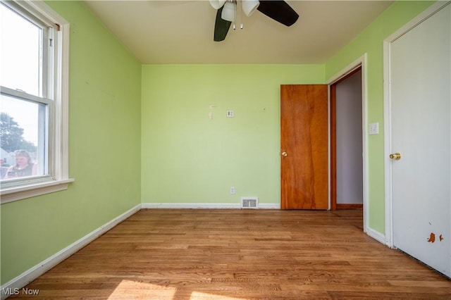 135 Renee Dr, Struthers, OH 44471 - unfurnished bedroom featuring wood finished floors and ceiling fan