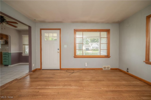 135 Renee Dr, Struthers, OH 44471 - entrance foyer featuring a ceiling fan and light wood-style floors