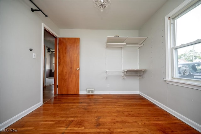 135 Renee Dr, Struthers, OH 44471 - walk in closet with wood finished floors