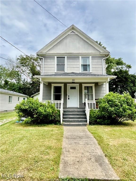 391 Cornell St, Akron, OH 44310 - view of front of home with a porch and a front lawn