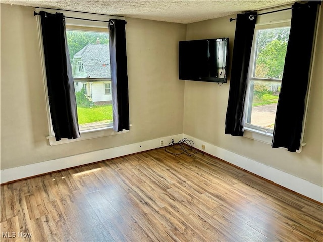 391 Cornell St, Akron, OH 44310 - unfurnished room with wood finished floors and a textured ceiling