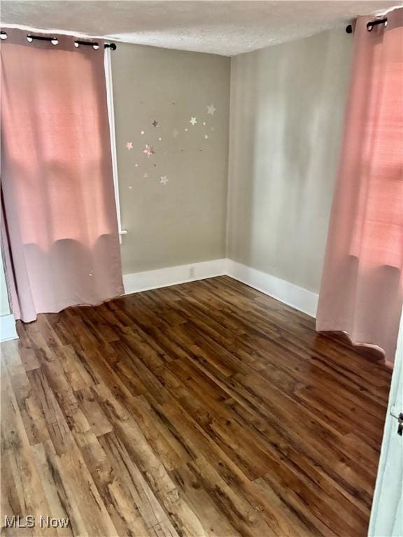 391 Cornell St, Akron, OH 44310 - empty room featuring hardwood / wood-style floors and a textured ceiling