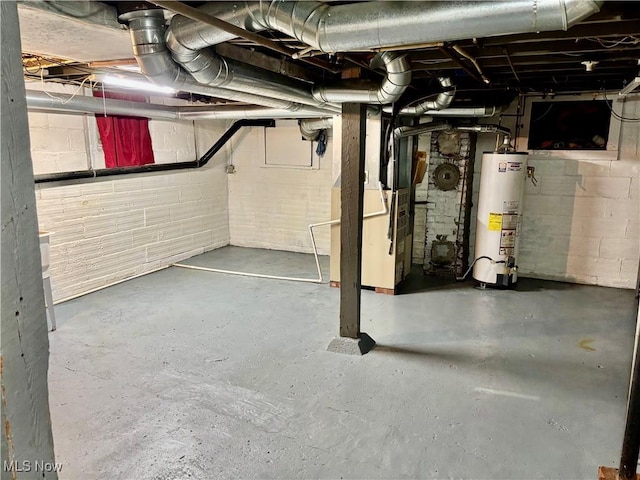 391 Cornell St, Akron, OH 44310 - unfinished below grade area with water heater, concrete block wall, and heating unit
