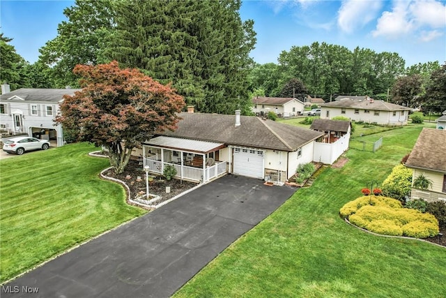 4477 S Warwick Dr, Canfield, OH 44406 - ranch-style home featuring covered porch, driveway, a garage, a front yard, and roof with shingles