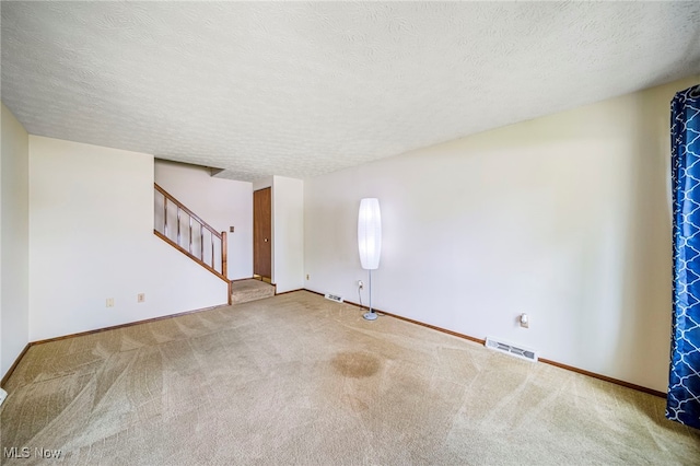 5523 Weston Ct Unit 88A, Willoughby, OH 44094 - empty room featuring stairway, carpet flooring, and a textured ceiling
