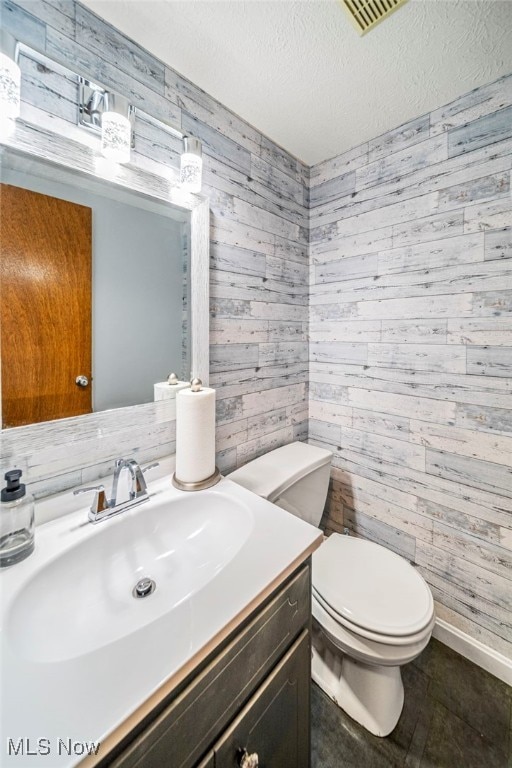 5523 Weston Ct Unit 88A, Willoughby, OH 44094 - half bathroom with wooden walls, vanity, and a textured ceiling