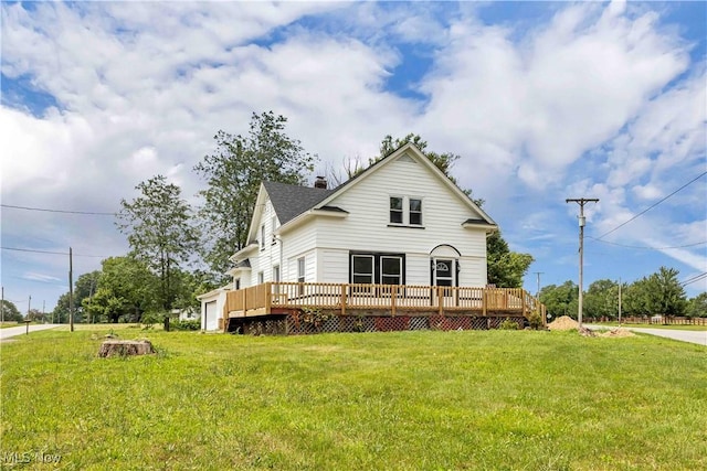 13050 Diagonal Rd, Salem, OH 44460 - view of front of home with a deck, a front yard, and an attached garage
