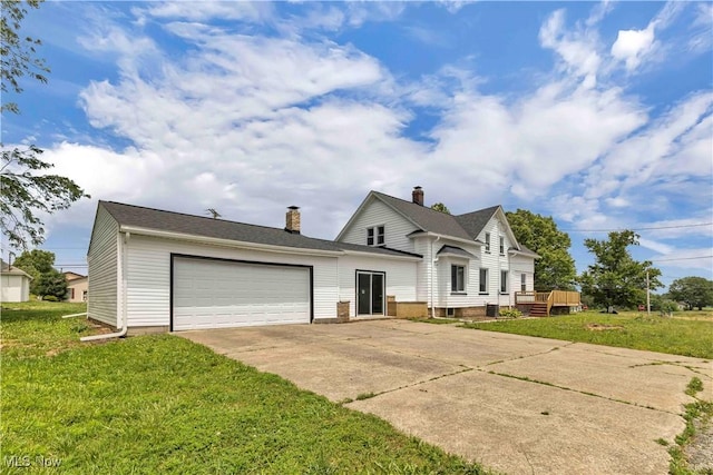 13050 Diagonal Rd, Salem, OH 44460 - view of front facade with driveway, a front lawn, an attached garage, a chimney, and a deck